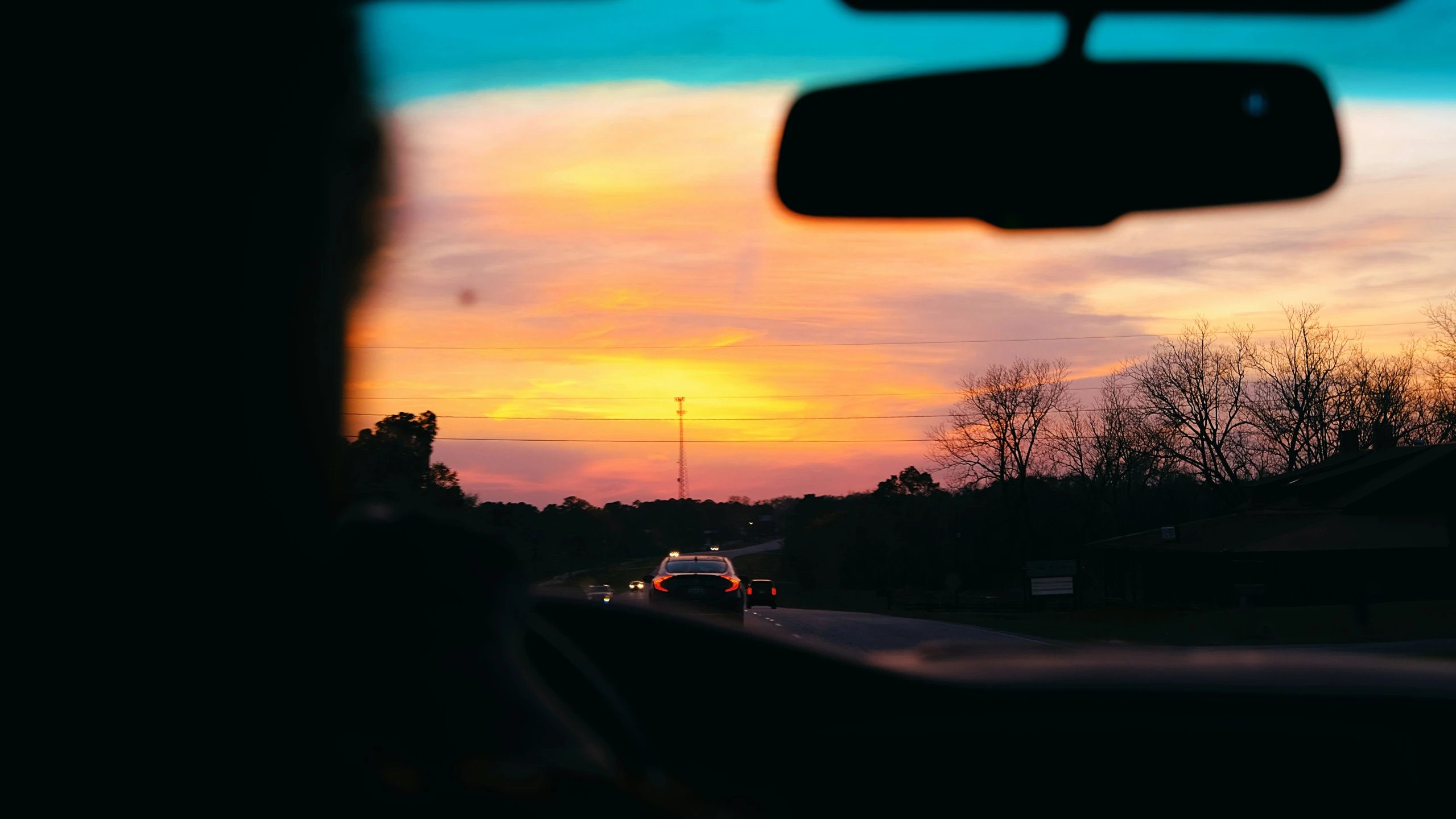 an image from a vehicle of a colorful sunset