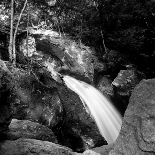 a black and white po of a waterfall