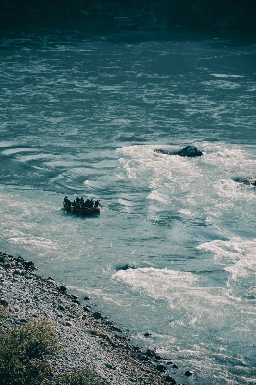 some small boats are floating in the water