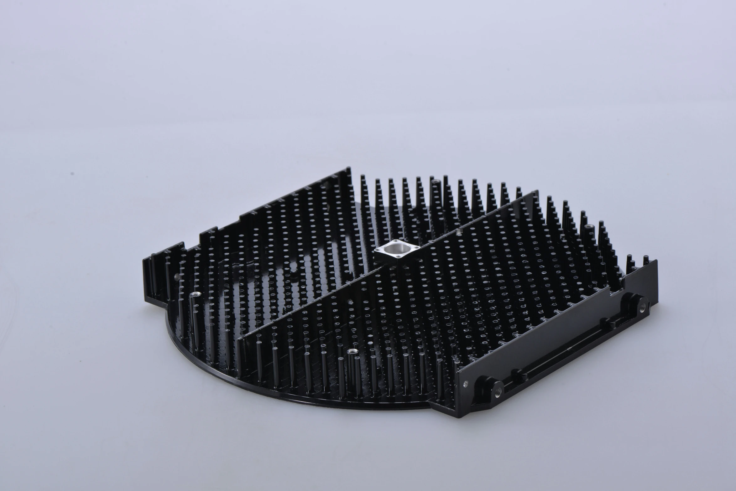 a large black comb is laying on a table