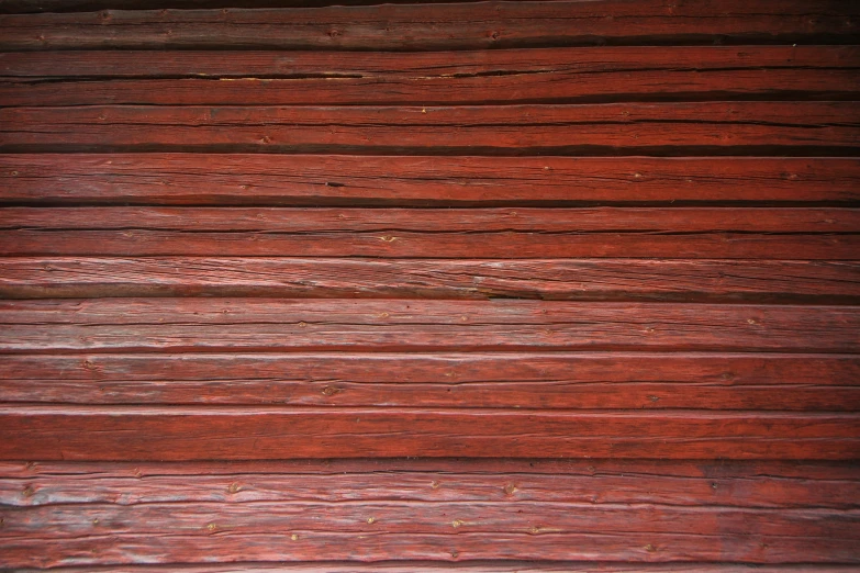 a wood bench with peeling paint and wood slats