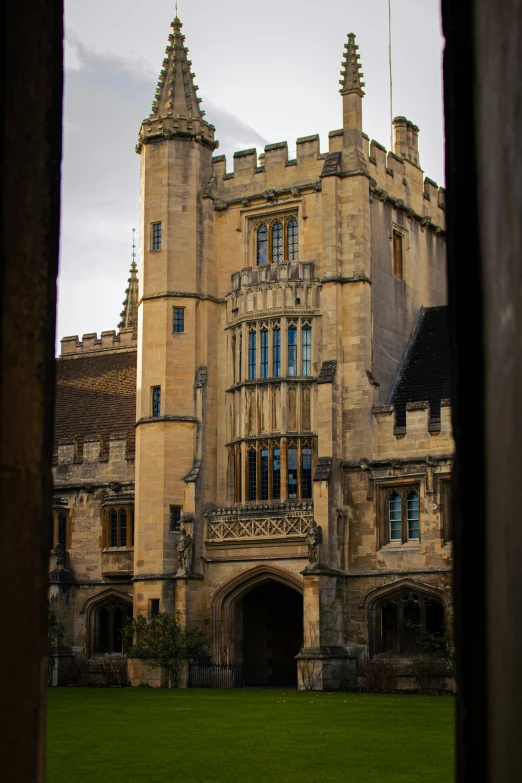 a beautiful, old, historic building with green lawn in front