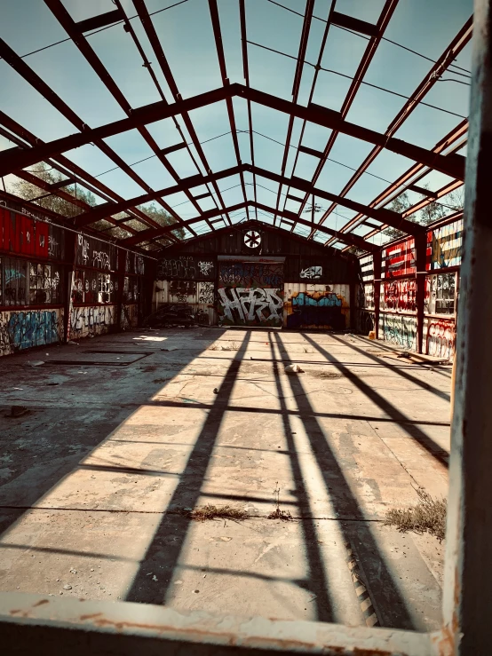 the interior of an abandoned building is covered with graffiti