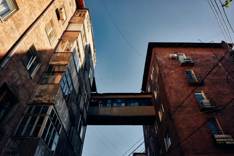 looking up at the side of two tall buildings