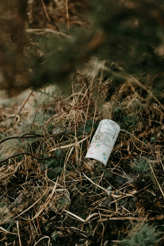 the bottle is left on the ground outside