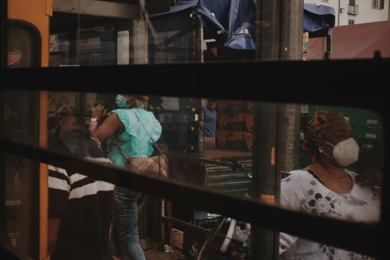 a woman walking down a street near buildings