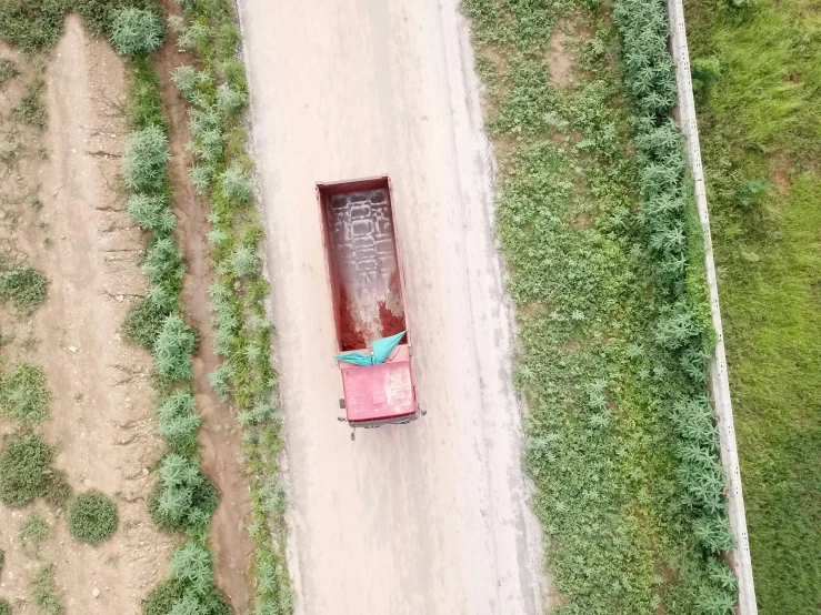 an overhead view of people in a truck going down the road