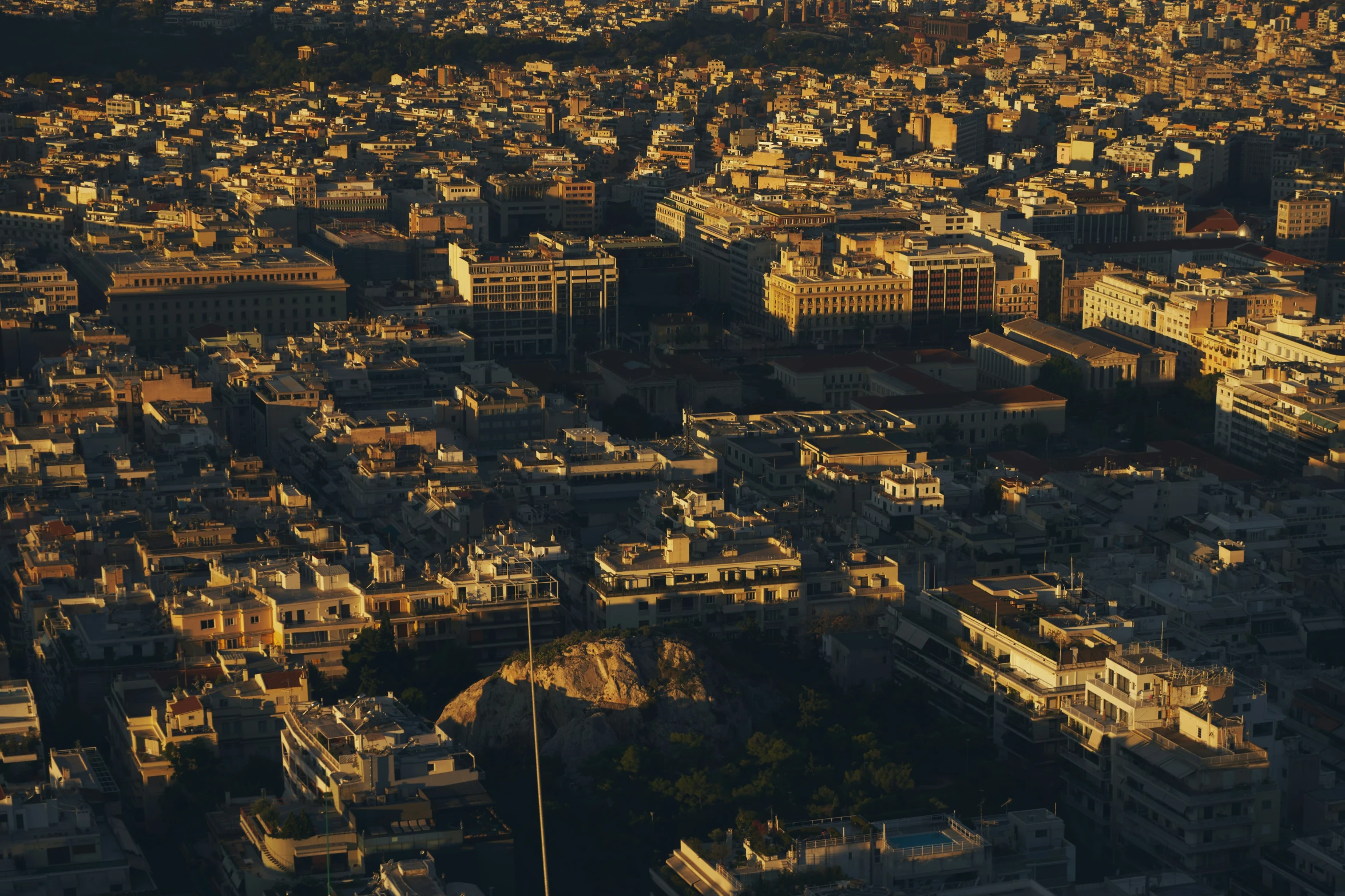 an aerial view of a city with tall buildings