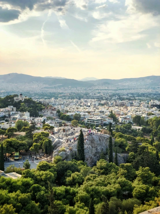 an aerial view of a city on the hill