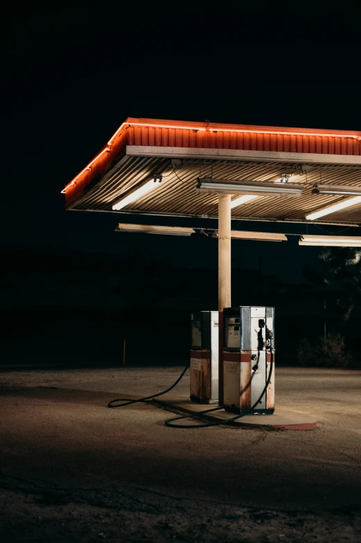 an old gas station with no people around it at night