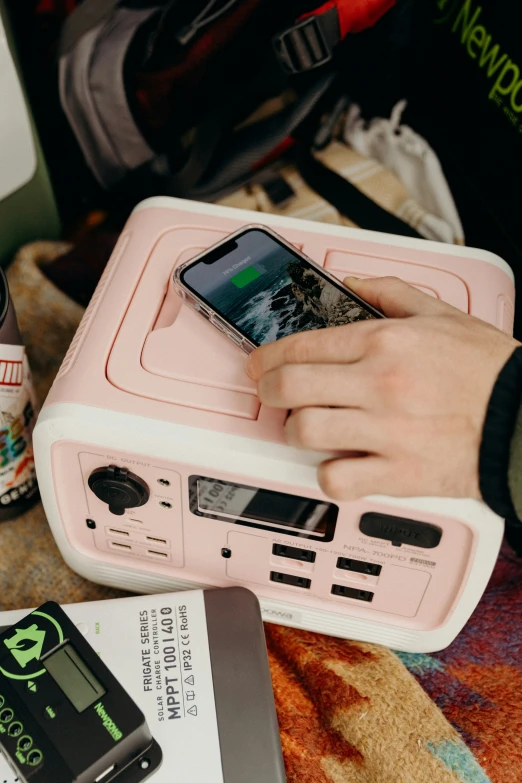 an ipod sitting on a portable speaker