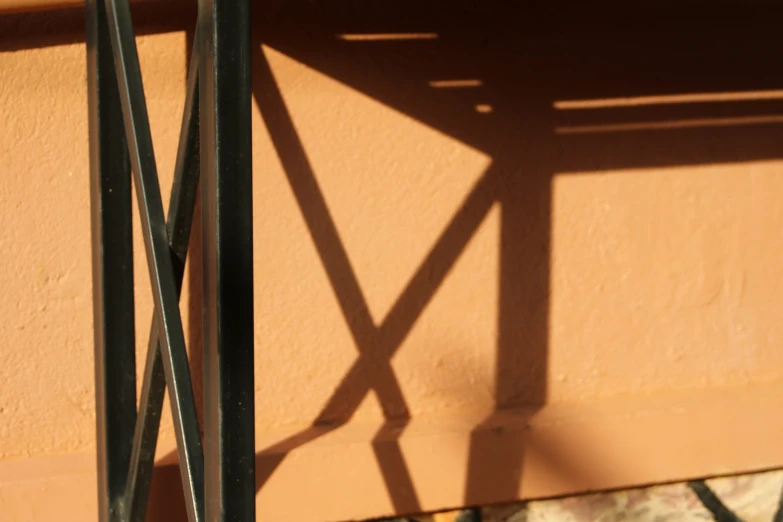 a shadow on a wall of some kind on a building