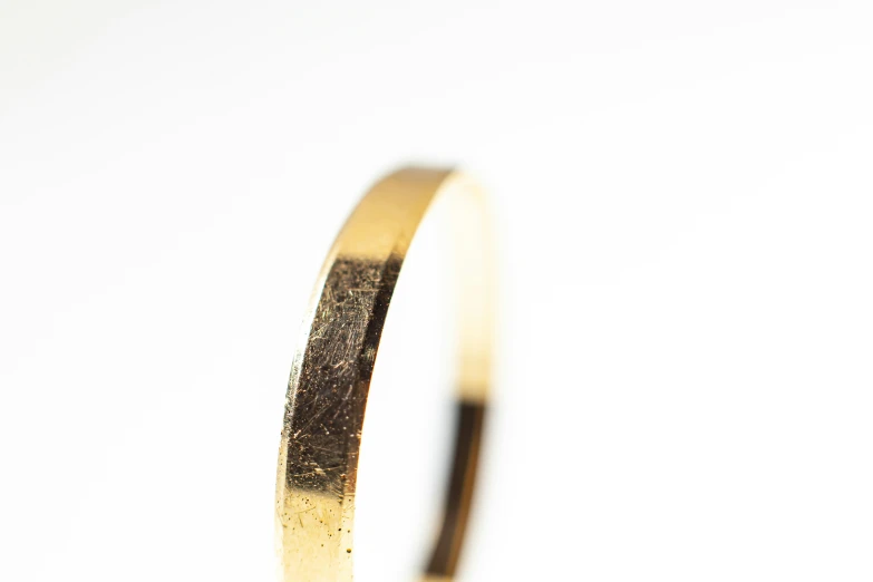 an image of a very thin yellow gold ring