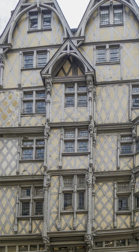 an old building with a lot of windows and intricate architectural work