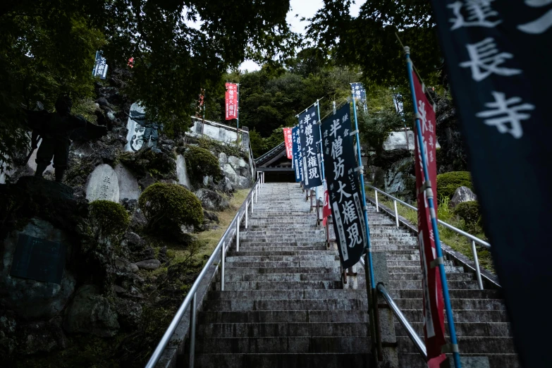 a set of steps with japanese signs on them
