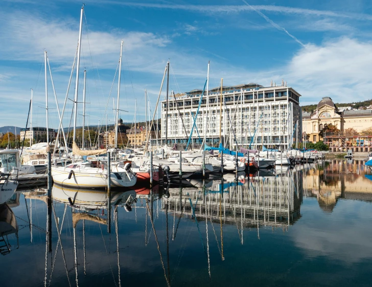 a harbor filled with lots of boats under a blue sky