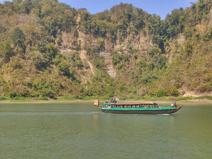 a tour boat filled with tourists going down the river