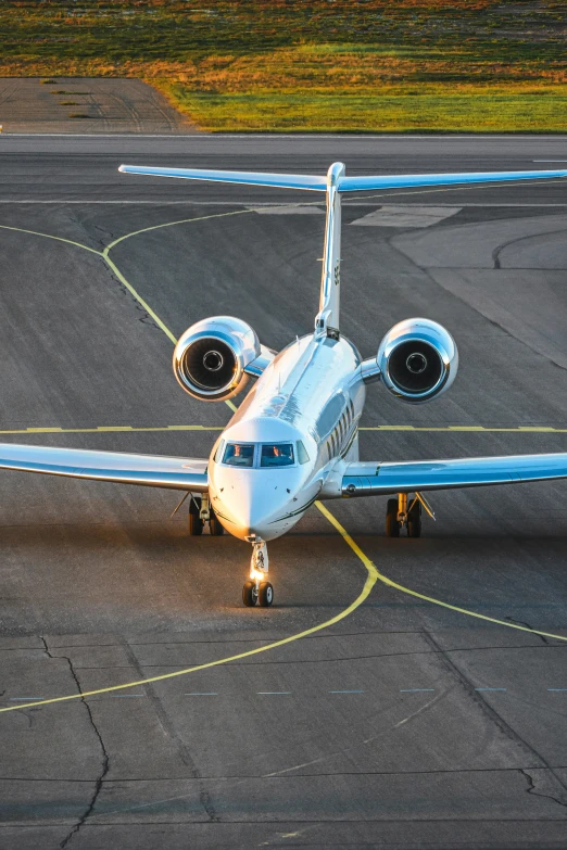 a jet airplane sitting on top of an airport tarmac