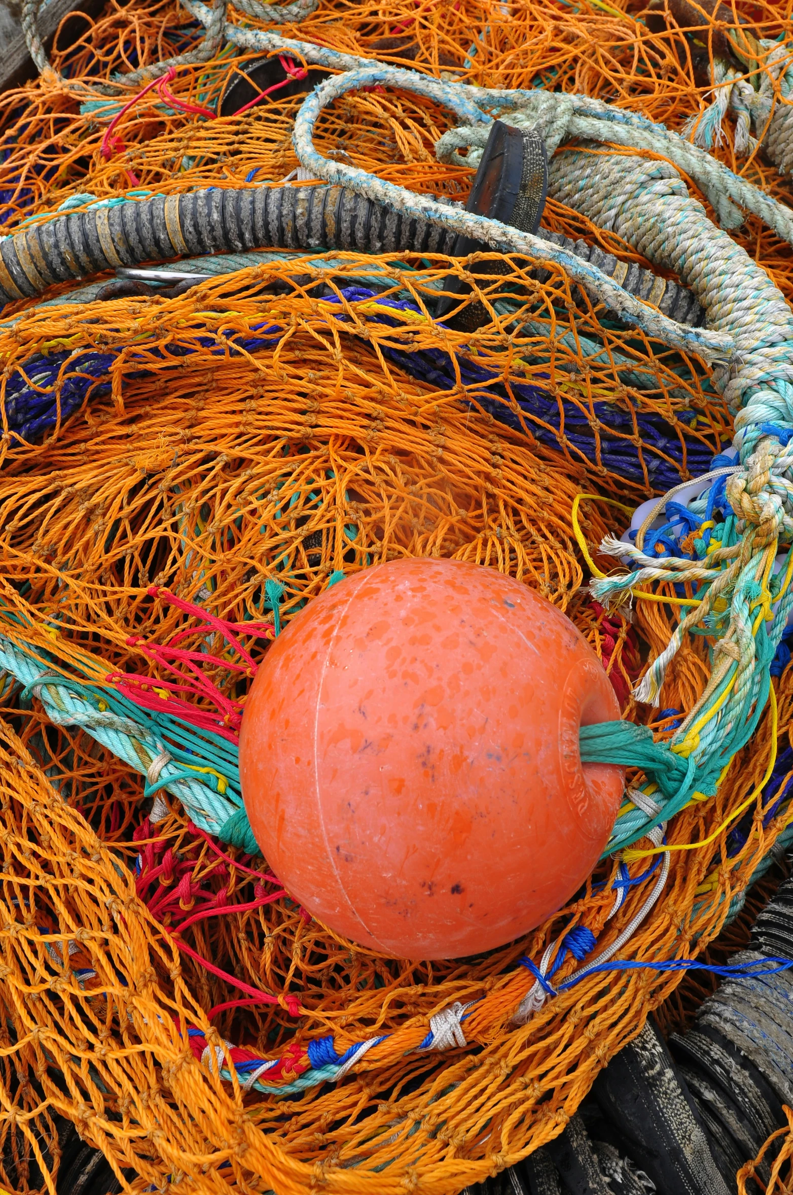 a ball sitting on top of fishing nets