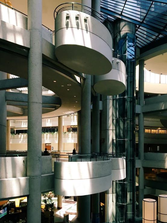 the lobby of a building that has columns on each side