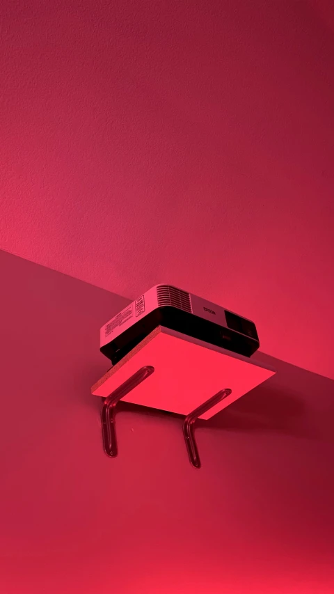 a red light is shining on a wall