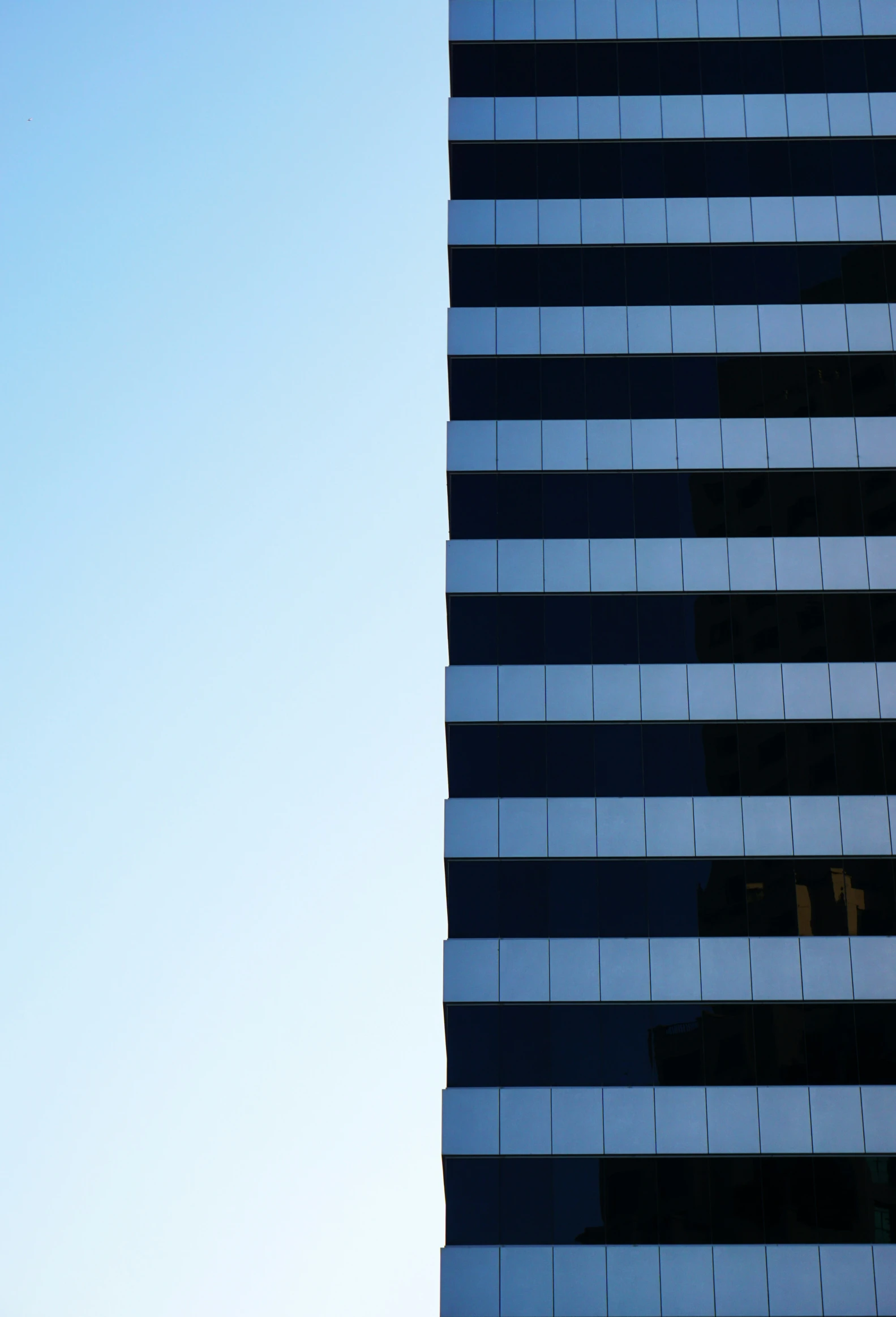 a clock on a building that is lit up with a lightening