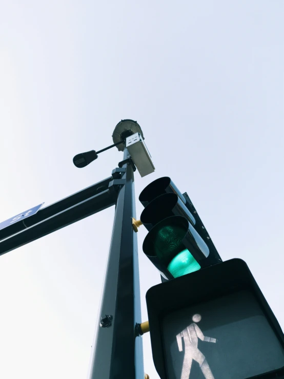 a traffic light is visible against a clear sky