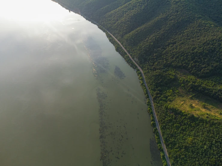 a waterway in the middle of some green land