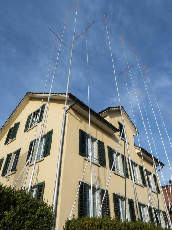 this is an image of several masts outside of a building