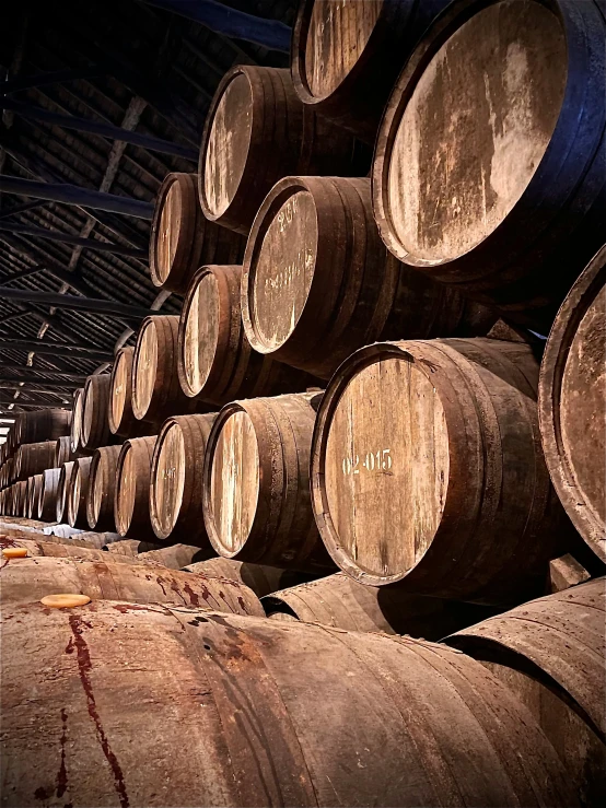 barrels stacked in a warehouse for wine and spirits