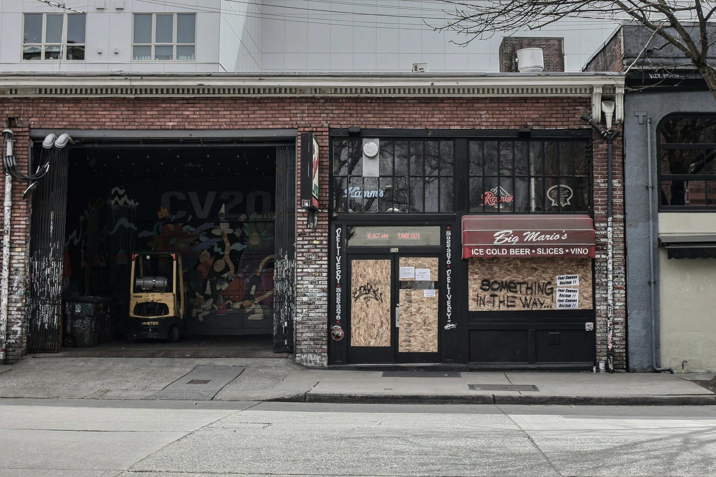 a building that has boarded down doors in it