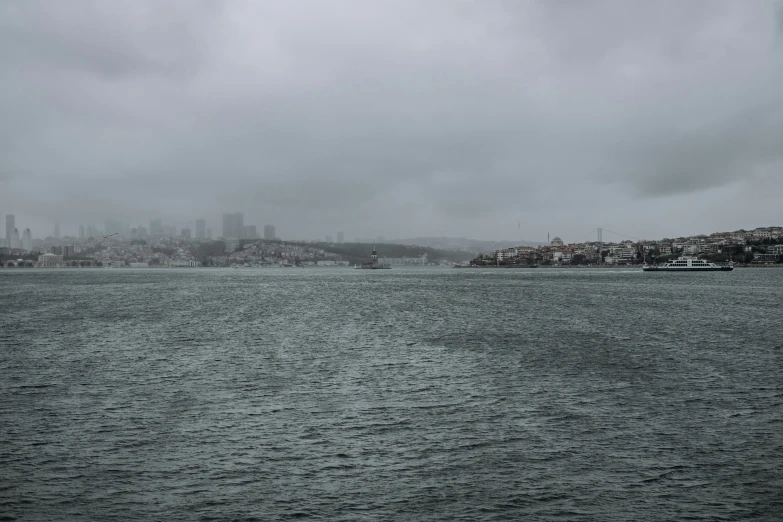 an overcast day by the ocean and a city