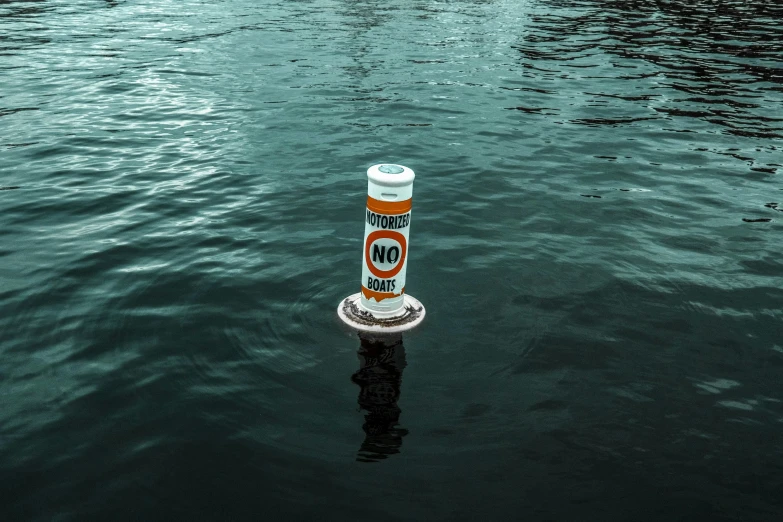 a tube of sunscreenr floating on water