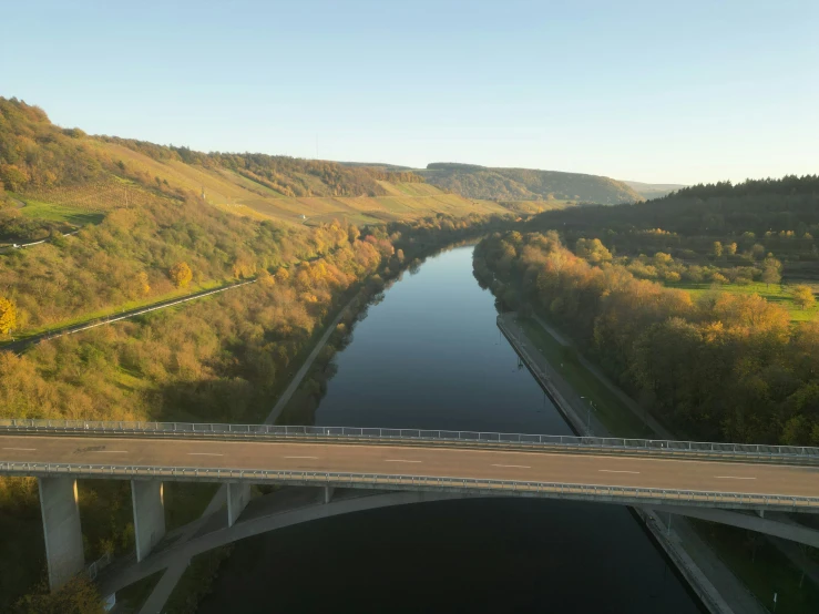 an overhead view of a highway that goes down to a river