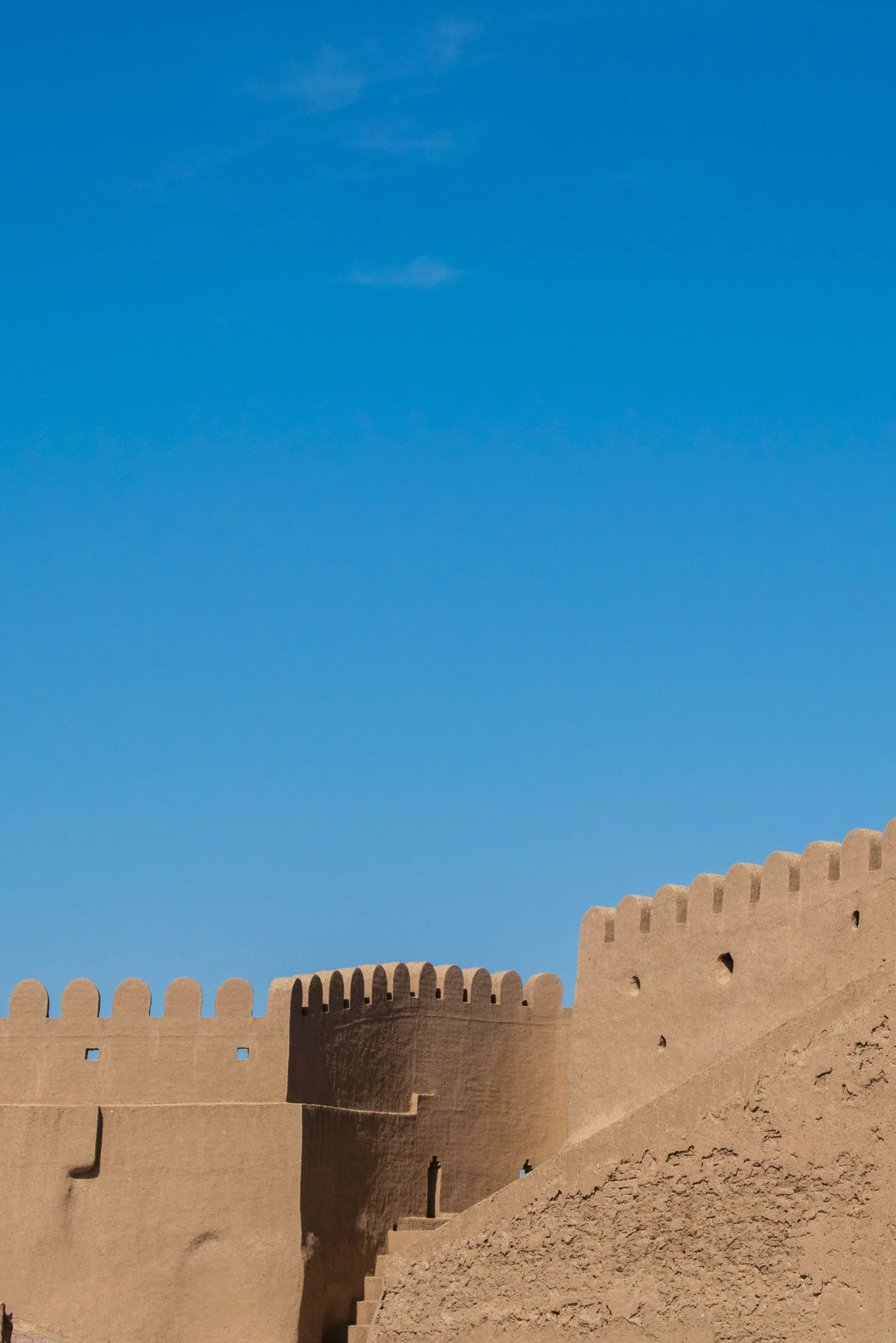 a brown adobe castle made in the desert