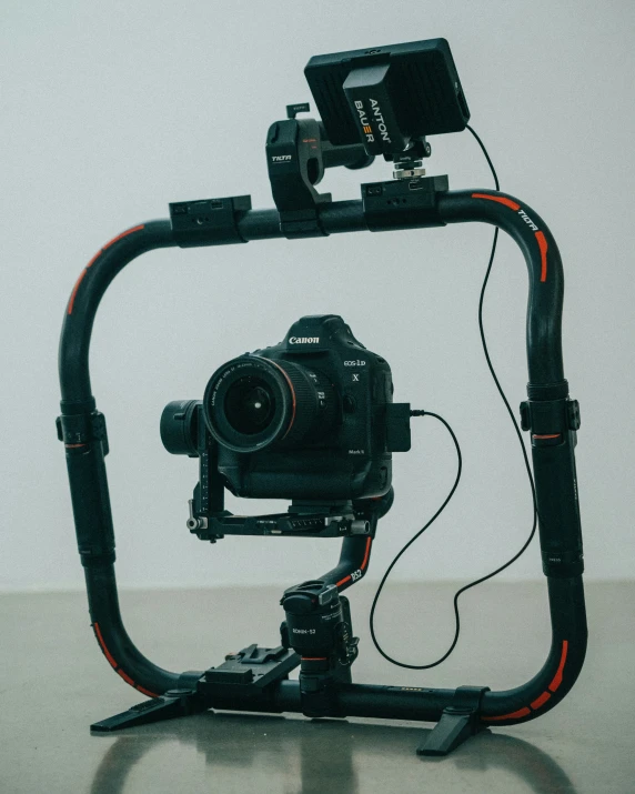 a black camera and camera attached to a large device
