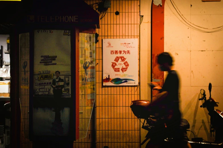 a person is sitting on a motorcycle and watching soing