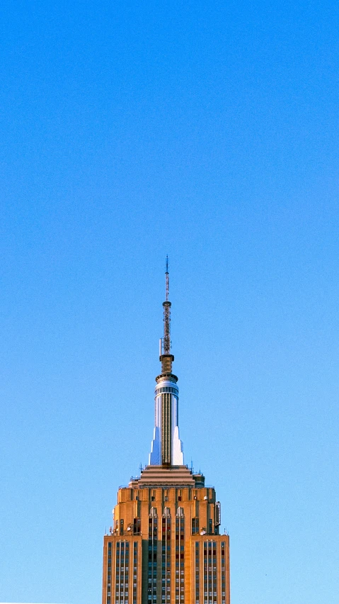 an old building on top with a blue sky in the background