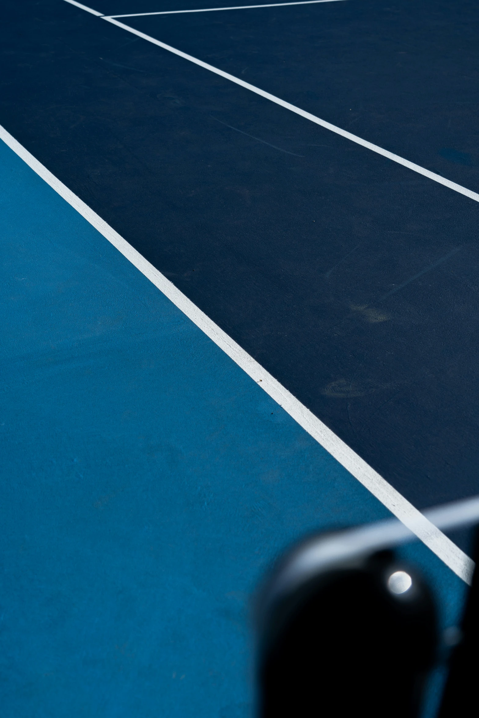 a tennis court has a blue and white color with lines