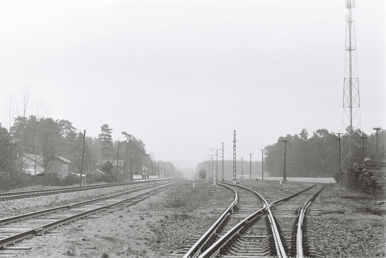some tracks that are in the middle of a foggy day