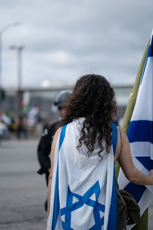 an israeli woman with a blue and white scarf