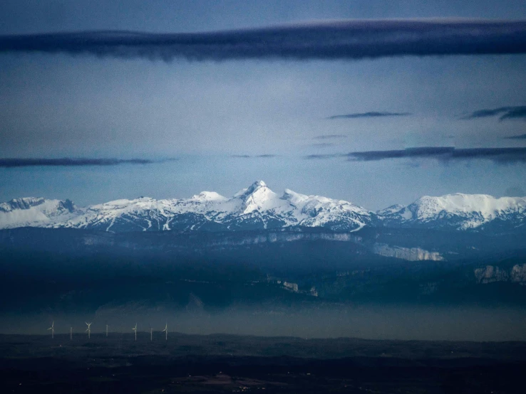 a big view of some mountains and clouds