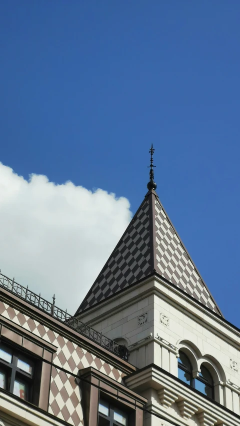 an architectural view of a building with a sky background