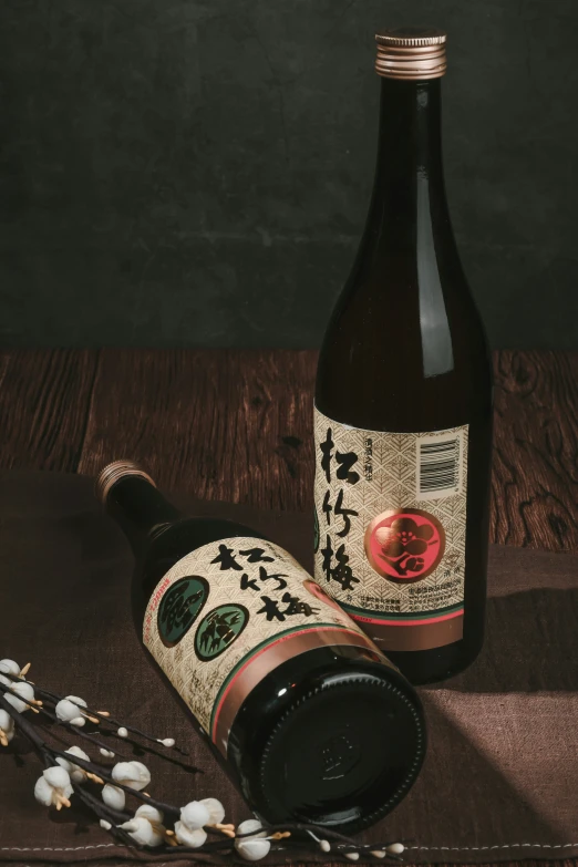 a bottle of sake and spoon sitting on a table