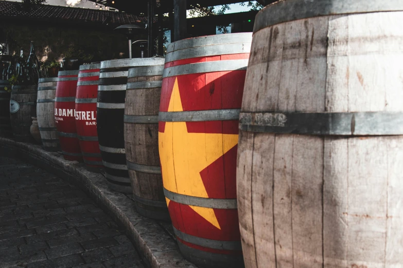 several barrels painted like red star and yellow star