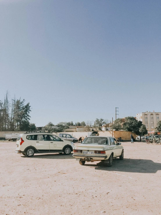 a group of cars parked on the street in front of a building