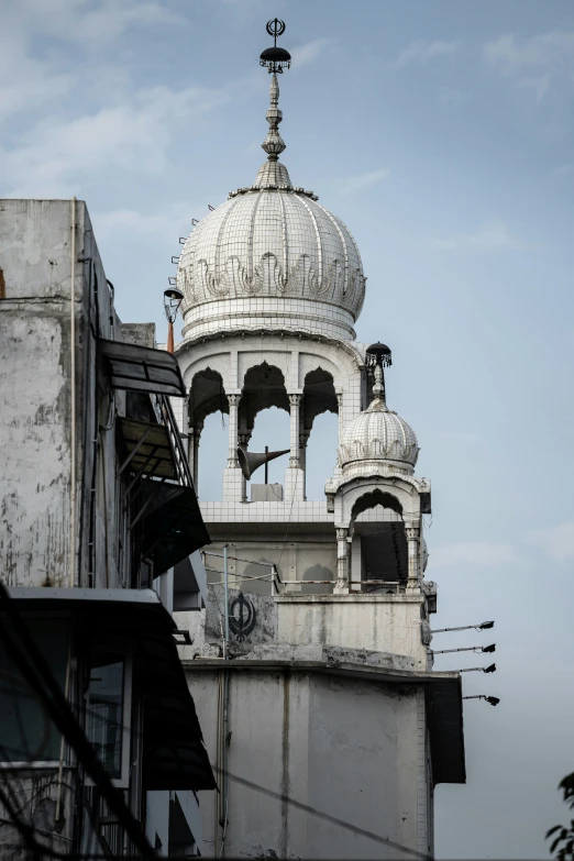 an old white roof with a clock tower