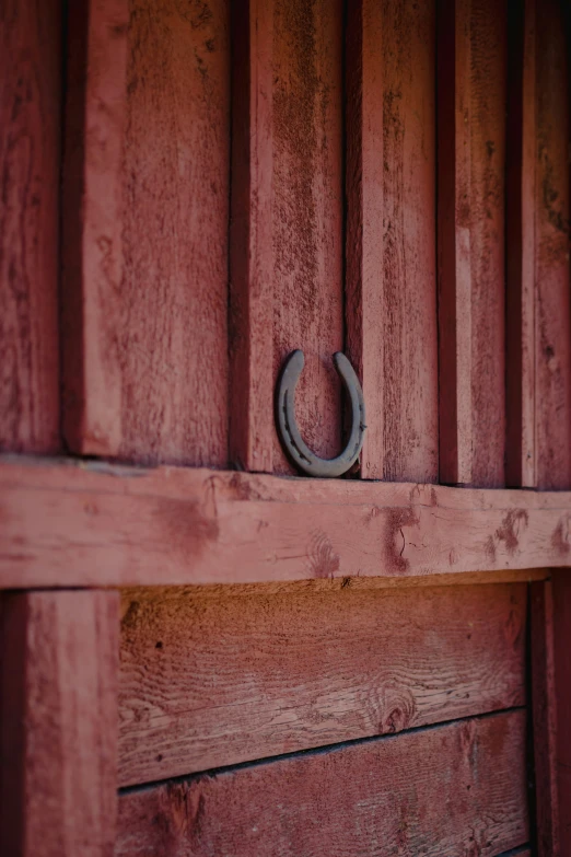 there is a horseshoe mounted to the side of a building
