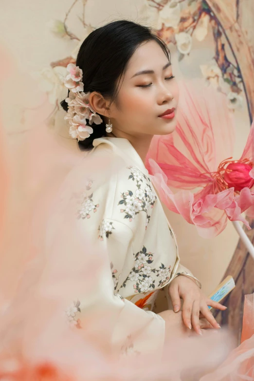 a woman is in the process of painting flowers on a wall