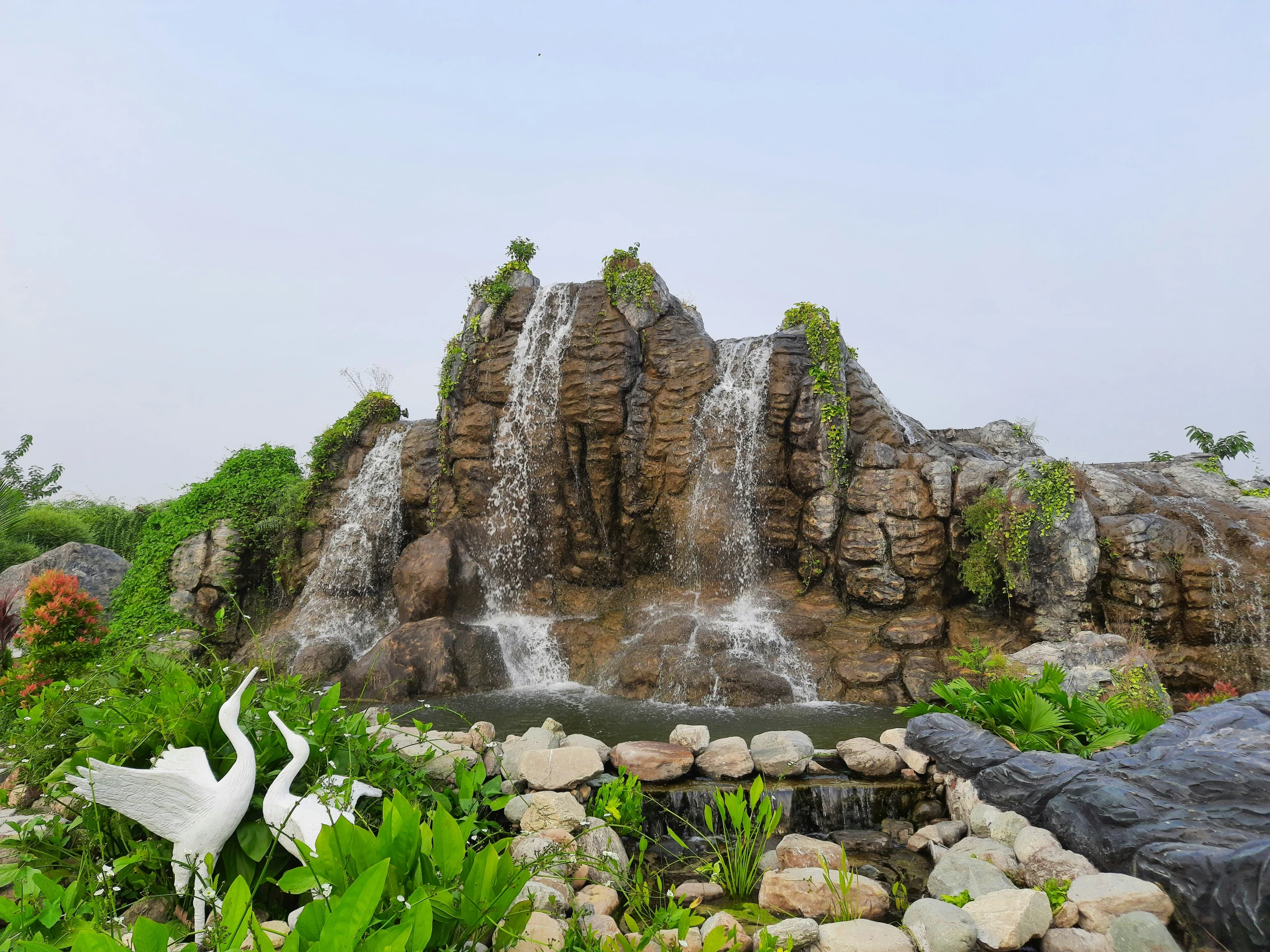 this is a waterfall in the forest on a clear day